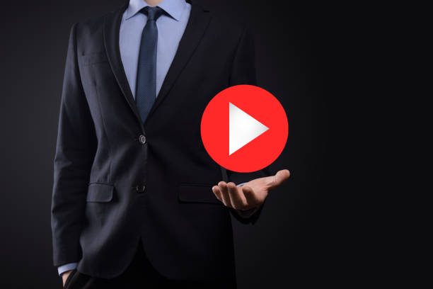 istock Businessman pressing, hold play button sign to start or initiate projects.Video Play Presentation. Idea for business, technology.media player button. Play icon.Go. 1341632072