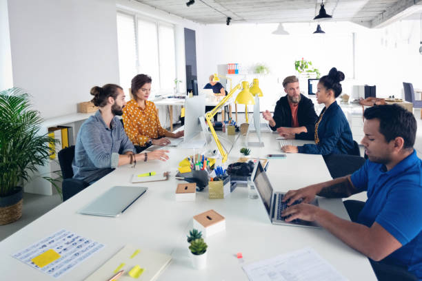 istock Business professionals working in new office 1341632851