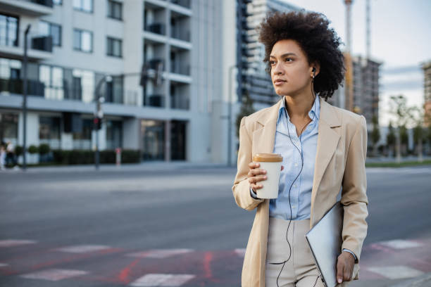 istock Well dressed woman  walking on the street after work 1341633033