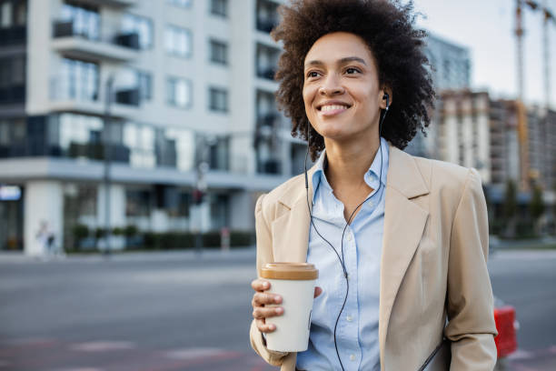 istock Well dressed woman  walking on the street after work 1341633120
