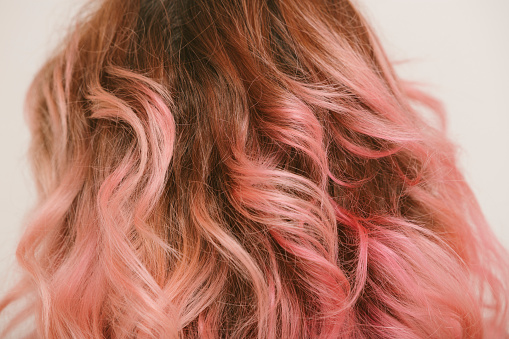 pink painted wavy hair detail