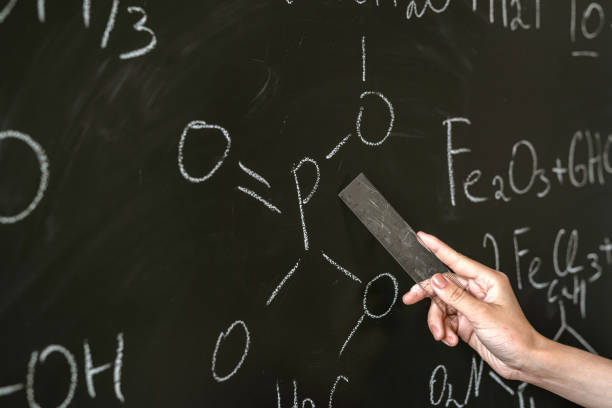 istock chemistry teacher writing and explain chemical formula on class board 1341633285