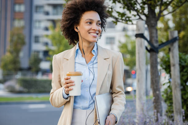 istock Well dressed woman  walking on the street after work 1341633480