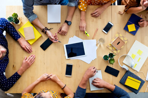 istock High angle view of business people at the table 1341633526