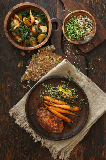 istock Roast duck breast with vegetables 1341633623