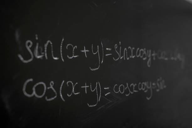 istock female teacher writing math formulas, cos and sin 1341633806