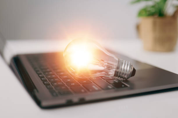istock Light bulb with laptop computer, innovation idea concept, idea of ​​inspiration from online technology 1341634353