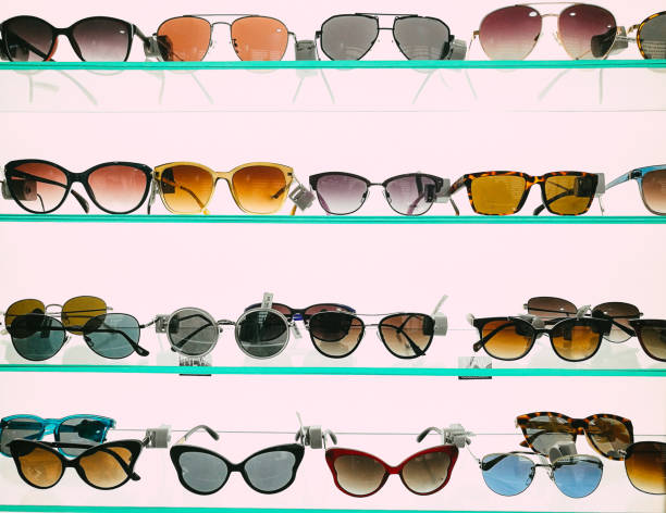 Modern fashionable sunglasses on display in store