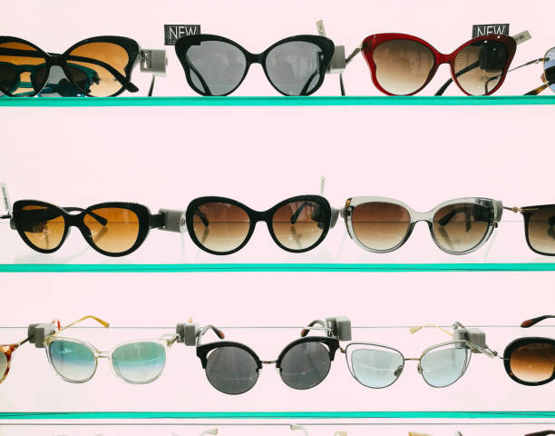 istock Modern fashionable sunglasses on display in store 1341637738