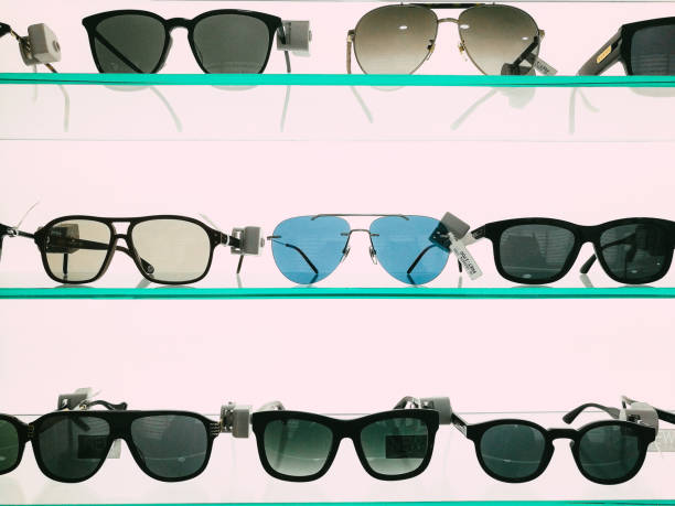 istock Modern fashionable sunglasses on display in store 1341637746