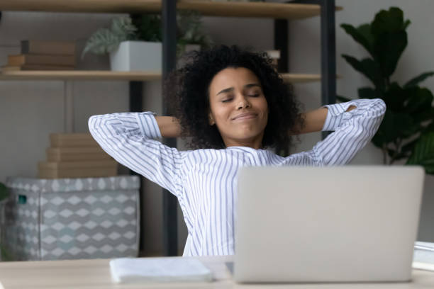 istock Happy mixed race female freelancer relax from work at desk 1341644013