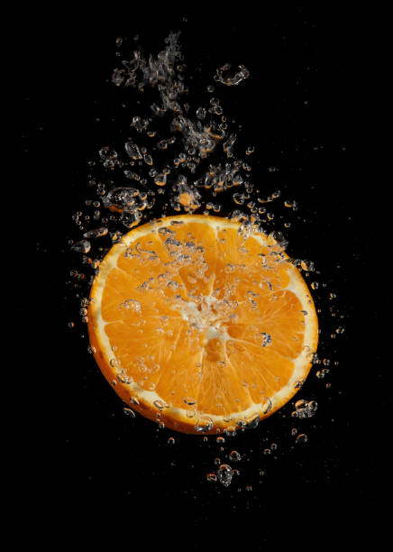 istock Orange splashing in water 1341646898