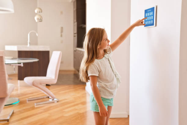 istock Little girl controlling smart devices with a digital tablet at home 1341647280