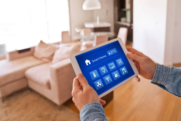 istock Man controlling smart devices with a digital tablet at home 1341647533