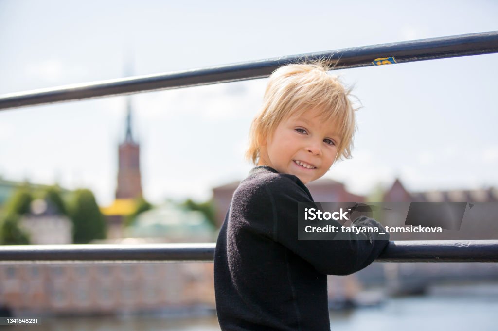 Young preschool child, visiting city of Stockholm with his family, sweden Young preschool child, visiting city of Stockholm with his family, summertime, Sweden 4-5 Years Stock Photo