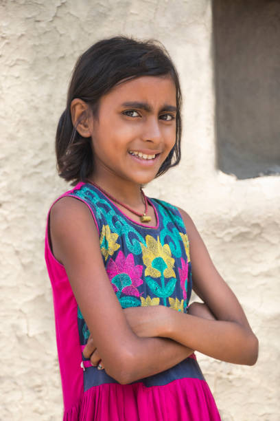 istock Indian rural girl folded hands standing at home 1341652026