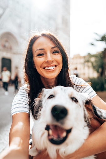 beautiful woman take a selfie with her dog