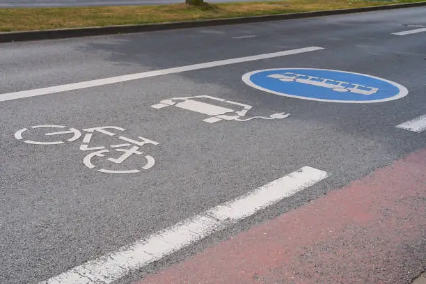 Street marking for electric cars, buses and bicycles. Lane marking.