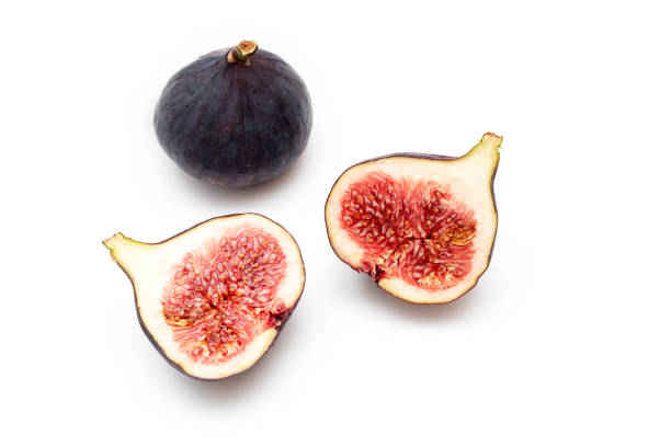 istock Pieces, slices of ripple figs isolated on white, top view, space for text 1341656798