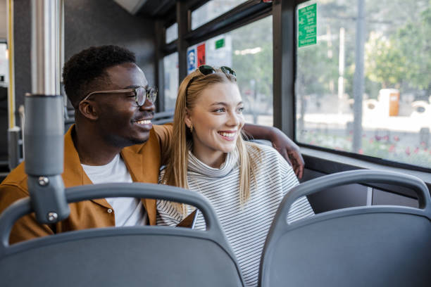 istock Passengers in public bus looking through the window 1341658074