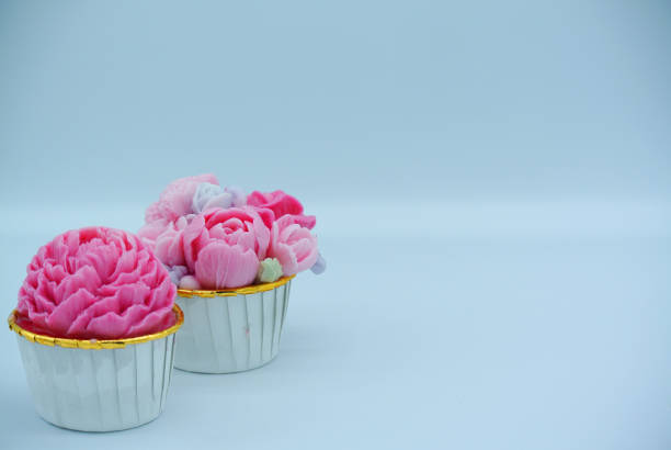 Jelly pink flower cupcake 2 in white background for copy space