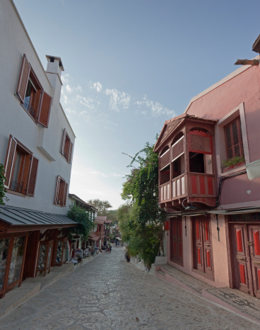 Traditional turkish row houses and stores in narrow alley - Kas, Antalya Province, Turkey, Asia