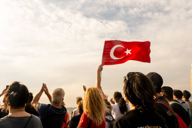 Crowded people and a Turkish flag stock photo