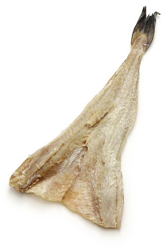 dried salted cod fish isolated on white background