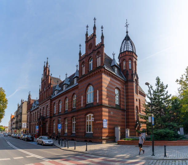 Gniezno, Poland - 7 September, 2021: historic red brick Gothic architecture building in downtown Gniezno