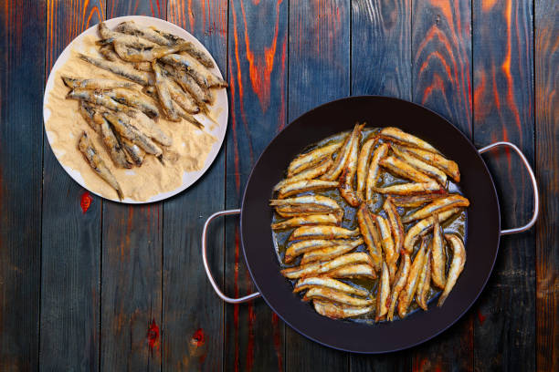 Boquerones fritos Mediterranean fried anchovies Boquerones fritos fried anchovies from Mediterranean Spain boquerones fritos stock pictures, royalty-free photos & images