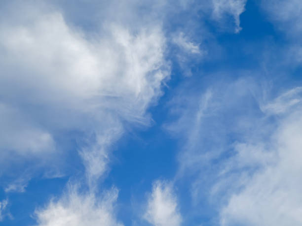 istock Blue sky with white fluffy clouds background. Summer blue sky and white cloud white background. Beautiful clear cloudy in sunlight calm season 1341663496