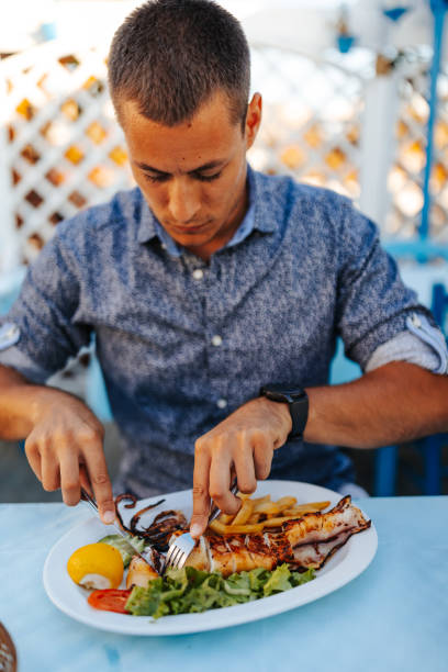 100+ Man Eating Squid Stock Photos, Pictures & Royalty-Free Images - iStock