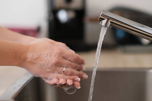 istock Female washing hands with water 1341664701