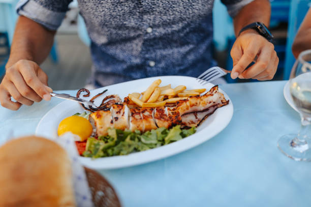 120+ Man Eating Squid Stock Photos, Pictures & Royalty-Free Images - iStock