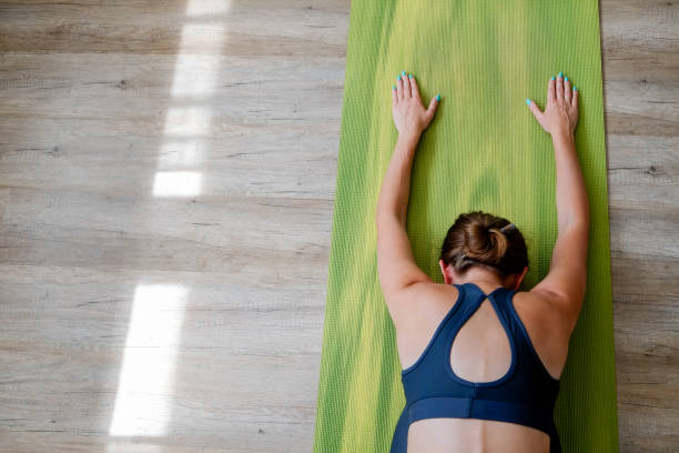 istock Yogini exercising at home 1341666600