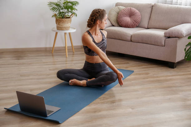 istock Yogini exercising at home 1341666649