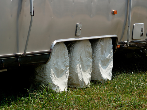 Springfield, MO, USA-June 29, 2005, 2005: Hundreds of Airstream trailers, motorhomes, and their owners gathered in Springfield, Missouri in June and July 2005 for the annual Airstream Club International rally. Wheel coverings on this trailer protect the tires from sustained sunlight that deteriorates them.
