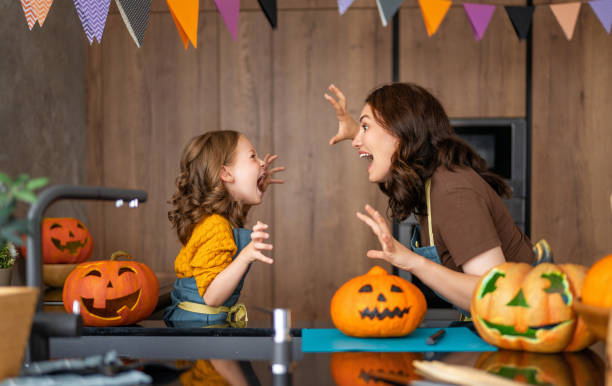 istock family preparing for Halloween. 1341667316