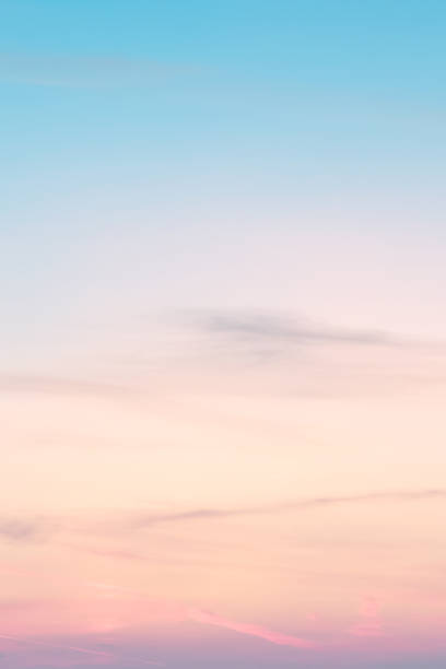 vertical ratio size of sunset background. sky with soft and blur pastel colored clouds. gradient cloud on the beach resort. nature. sunrise.  peaceful morning. instagram toned style - dawn sunrise cloud cloudscape imagens e fotografias de stock