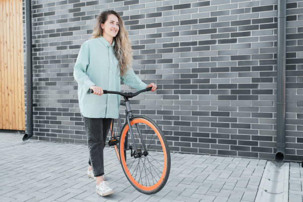 istock Woman Walking With Bicycle 1341670418