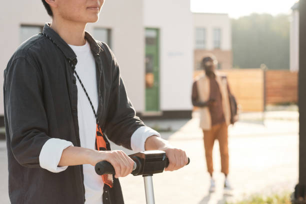 istock Unrecognizable Woman Riding Scooter 1341672155
