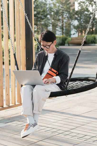 istock Asian Freelancer Working Outdoors 1341672379