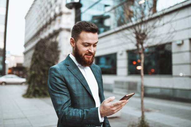 istock Bearded Businessman Looking For Place To Relax On Smartphone Map 1341672700