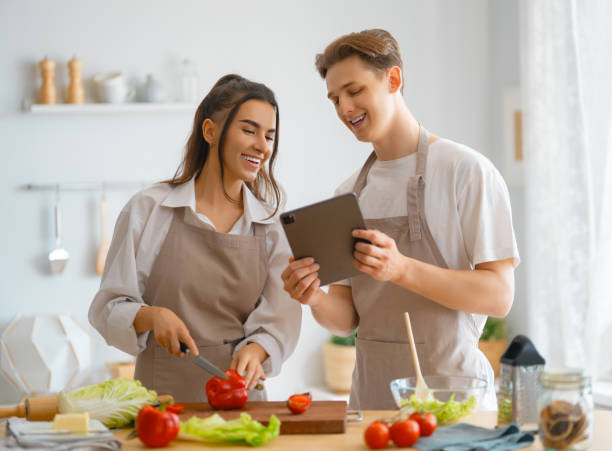 istock couple is preparing the proper meal 1341673546