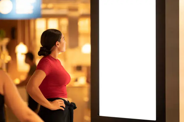 Photo of Young woman is shopping for home at furnishings store.