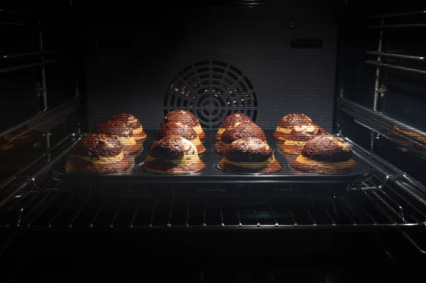 istock Chocolate muffins in oven 1341679479