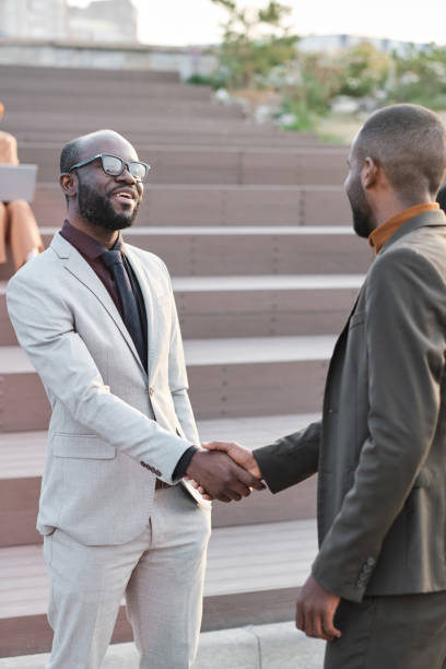 istock Male Colleagues Greeting Each Other 1341679742