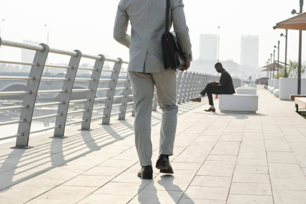istock Unrecognizable Businessman Walking Along Street 1341680907