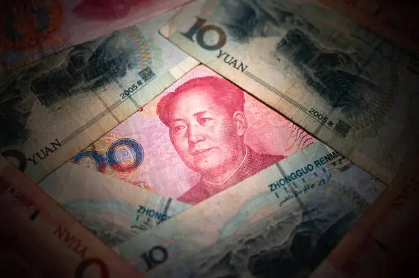 Close-up of Chinese Yuan banknotes, with Mao Tse-Tung's face