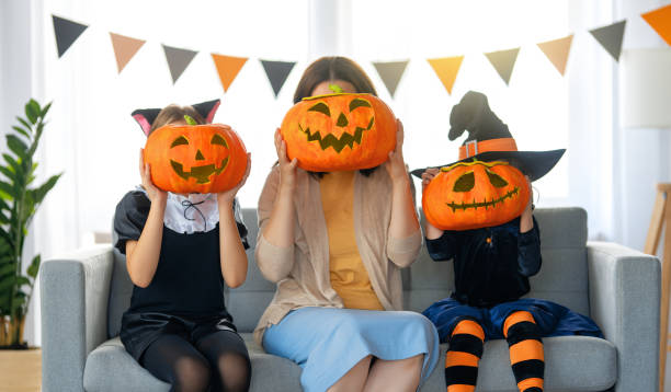 istock Happy family celebrating Halloween 1341682423